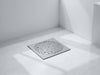 Create a realistic image of DrainWise Versatile Floor Drain in a modern bathroom setting, emphasizing durability., vector, best quality, masterpiece