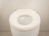 "WarmEmbrace Toilet Seat Lid Cover: luxurious, cozy warmth, plush cushioning, elegant style, bathroom comfort, inviting design.", vector, best quality, masterpiece