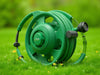 Create an image of 'GardenGuardian Hose Reel' in action, showcasing sleek design, durability, and neat garden., vector, best quality, masterpiece