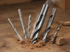 "TurboTwist Premium Drill Bits: high-speed steel, precision tips, wood, metal, clean, accurate, durable performance.", vector, best quality, masterpiece