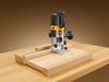 "ProAlign Router Jig: woodworker using precision tool, seamless cuts, durable construction, DIY, professional, accuracy.", vector, best quality, masterpiece